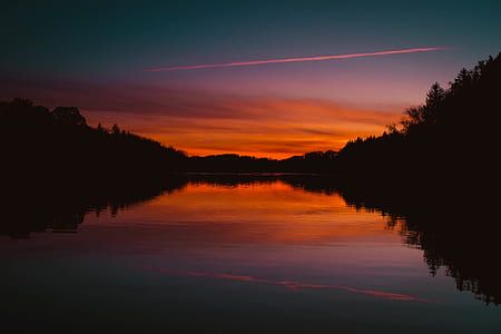 body of water during golden hour thumbnail