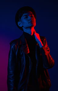man wearing black leather jacket and fedora hat thumbnail