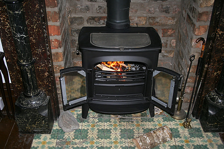 black fireplace beside poker set thumbnail