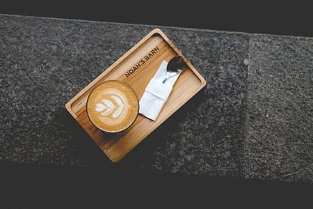brown wooden tray on black textile thumbnail