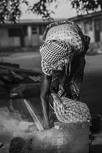 person holding basket grayscale photo thumbnail