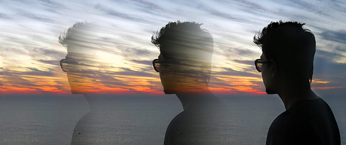 man wearing sunglasses looking on sea surface thumbnail