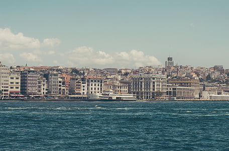 high rise buildings near body of water at daytime thumbnail