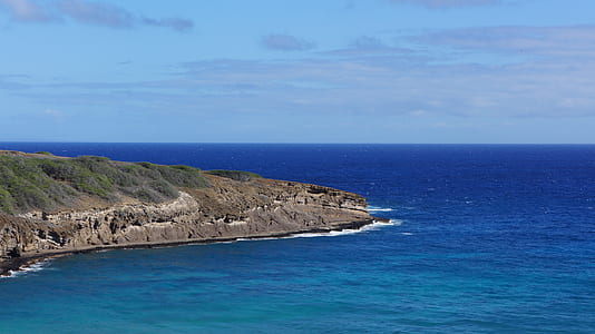 aerial view photography of cliff beside ocean thumbnail