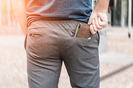 Man’s hand taking wallet from his own pocket thumbnail