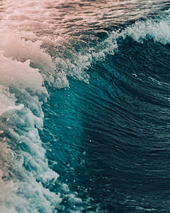 water waves towards shore during daytime thumbnail