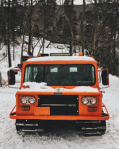 orange Chara SM-20 car on snowfield near forest thumbnail