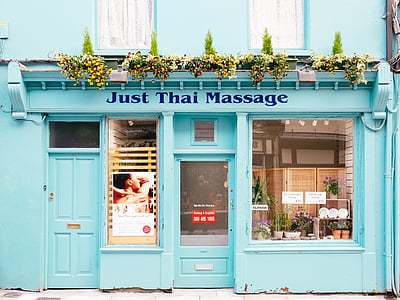 Just Thai Massage signage on teal wall thumbnail