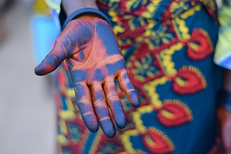 selective focus photography of right human palm with blue paint thumbnail