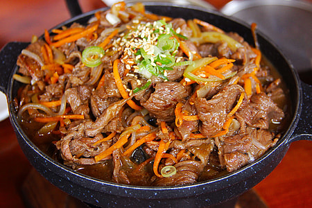 cook food on black cooking pot thumbnail