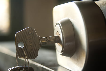 stainless steel key left on a lock thumbnail