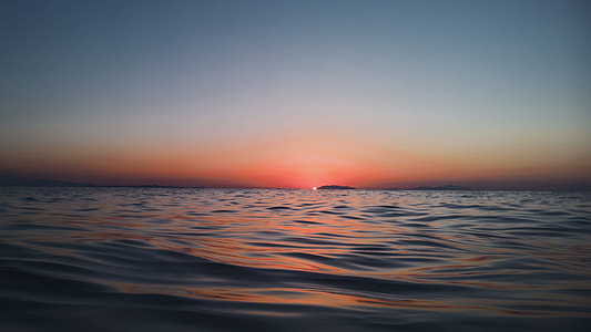 calm water and view of sunset thumbnail