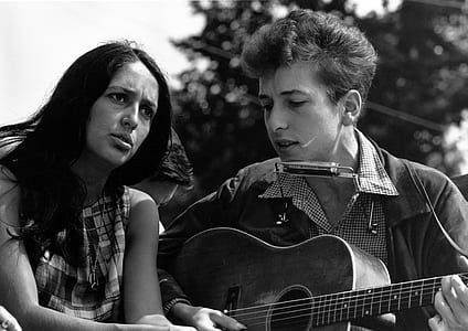 grayscale photography of man and woman playing guitar thumbnail