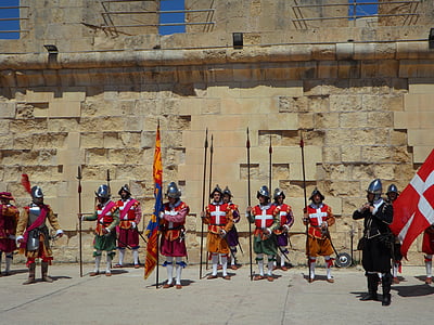 group of medieval knight cosplayers standing in front of brick wall thumbnail