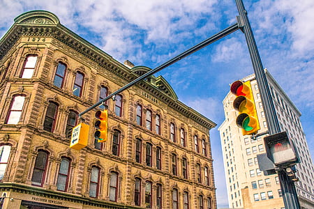 traffic light near brown building thumbnail