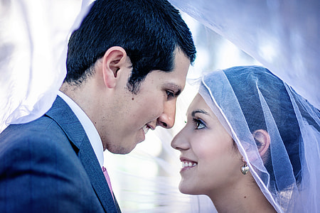 man and woman in wedding vow photo during daytime thumbnail