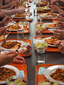 people eating spaghetti on table thumbnail