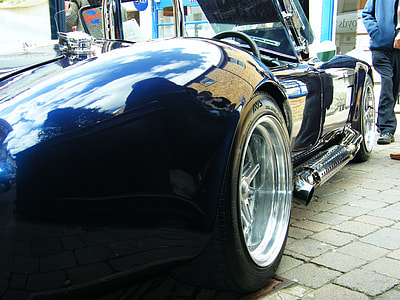 close-up photography of blue sports car thumbnail