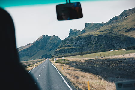 clear asphalt road near mountain range thumbnail