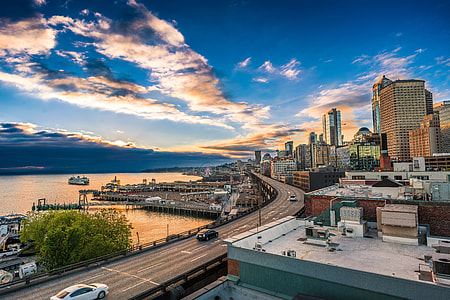 cityscape near body of water during daytime thumbnail