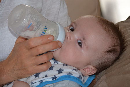 person holding feeding bottle thumbnail
