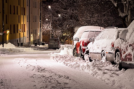 snow covered cars during nighttime thumbnail