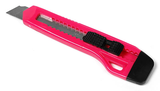 pink and black utility cutter on white top thumbnail