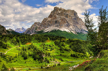 brown mountain near green grass thumbnail