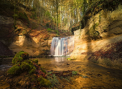 timelapse photography of waterfalls with green foliage trees thumbnail