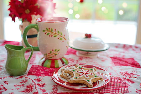 white, green, and red ceramic mug on red and white table clock thumbnail