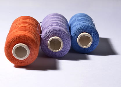 three orange, purple, and blue threads thumbnail