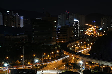 buildings near bridge taken during night time thumbnail