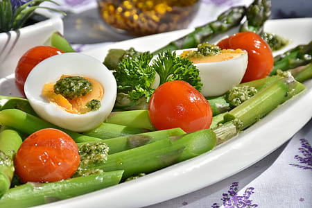 orange tomato and white egg on white ceramic plate thumbnail