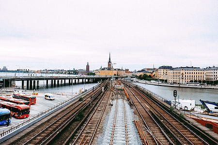 brown rail road on body of water thumbnail