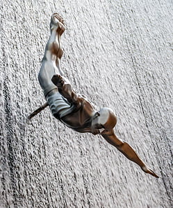 brass figure of man on wall thumbnail