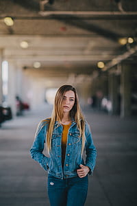 woman standing in the middle of car park thumbnail