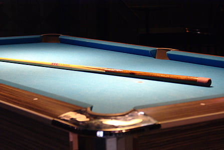 blue and brown billiard table with cue stick thumbnail
