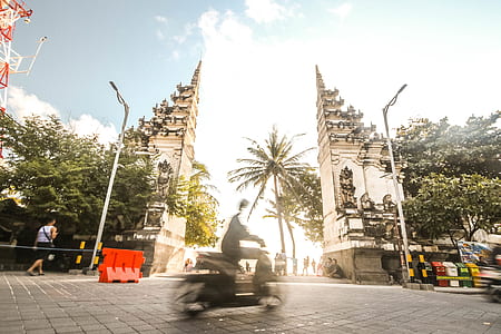 man riding on motor scooter thumbnail