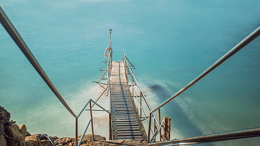 Brown Dock Bridge on Body of Water thumbnail