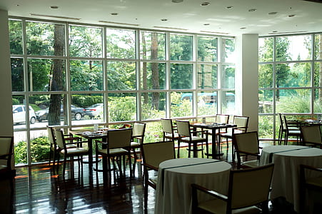 empty tables and chairs in restaurant thumbnail