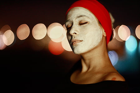 woman wearing black top with white cream on her face thumbnail