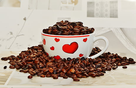 coffee beans on white and red ceramic mug thumbnail