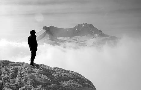 silhouette person on gray stone formation thumbnail