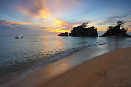 boat sailing on ocean during sunset thumbnail