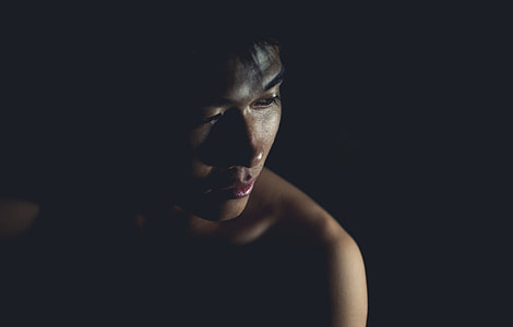 low light photo of topless person thumbnail