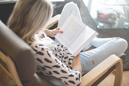 Woman Reading a Book in a Chair thumbnail