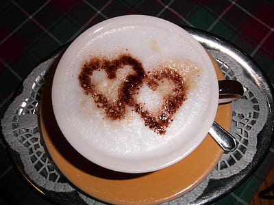 white ceramic teacup filled with coffee thumbnail