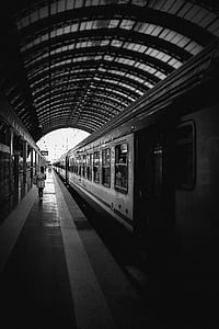 grayscale photography of train on station thumbnail