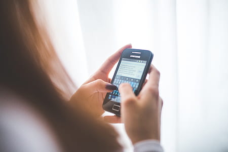 person holding black Samsung Android smartphone thumbnail