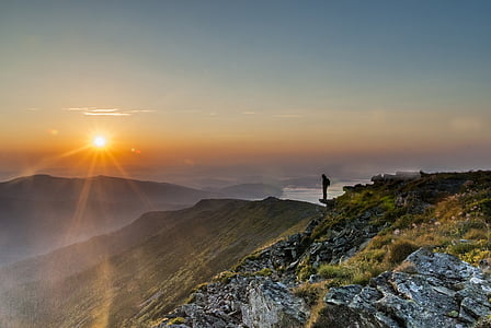 birds eye view of person standing on cliff thumbnail